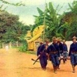 American troops carry a wounded comrade in the Philippine American War